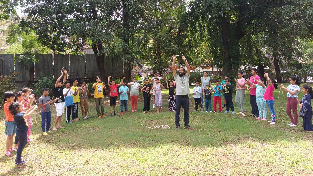 Children practising yoga and mindfulness during camp activities.