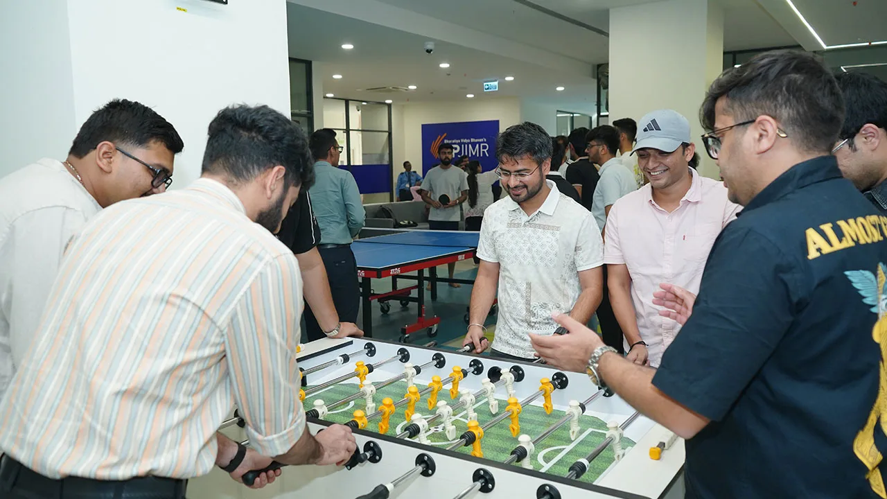 Students engaged in competitive indoor sports at Dhanda Fest.