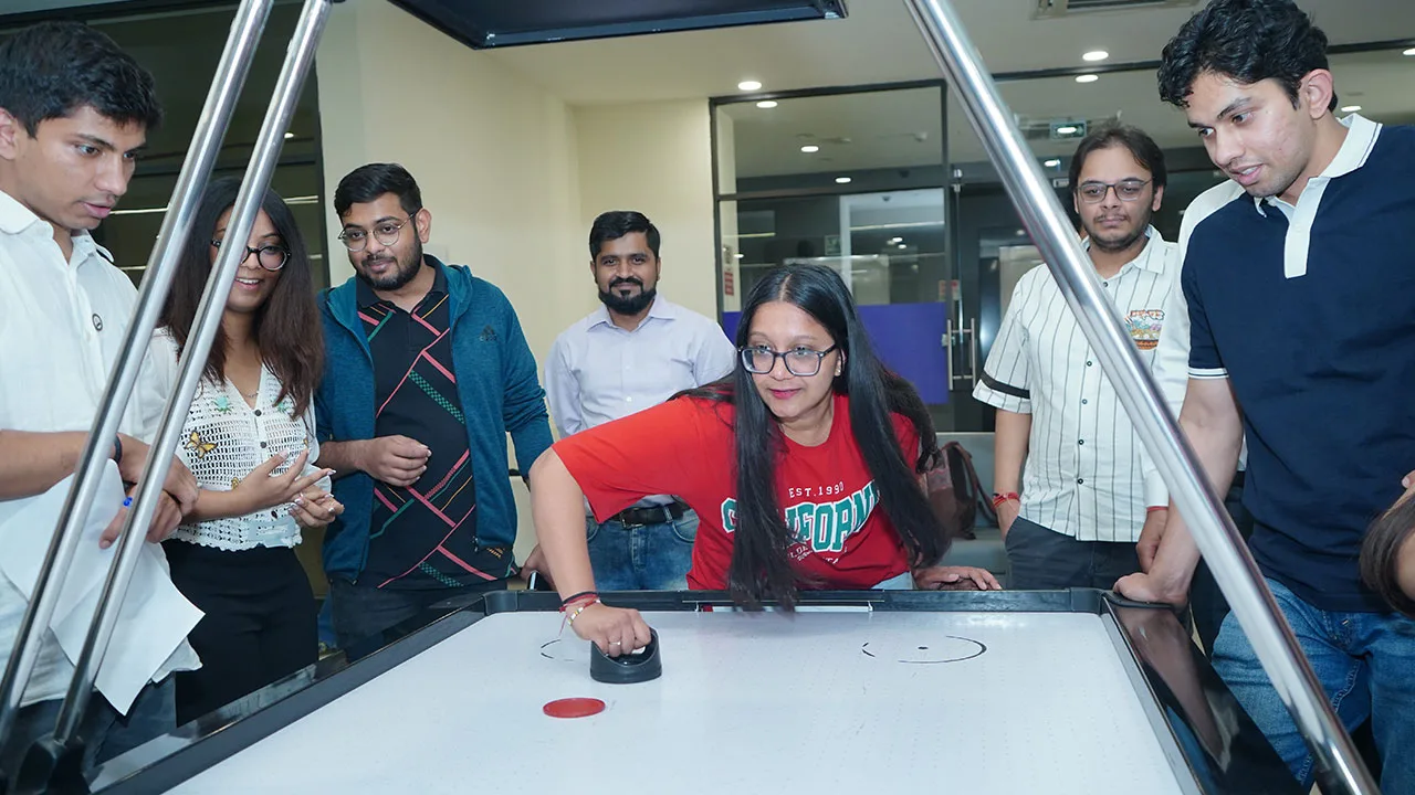 Air hockey match in progress during Dhanda Fest at SPJIMR.