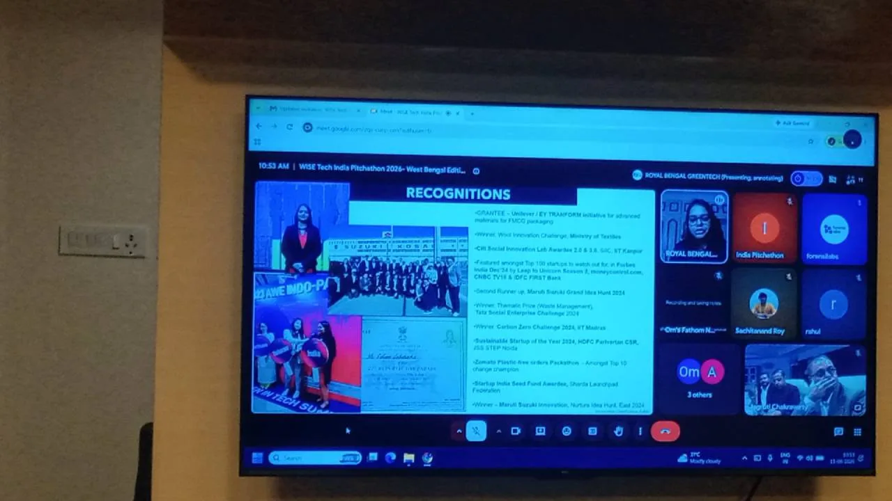 Monitor showing a virtual meeting with a slide titled 'RECOGNITIONS' and participant tiles on the right area.